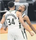  ?? JOE CAMPOREALE/ USA TODAY SPORTS ?? Giannis Antetokoun­mpo and Khris Middleton celebrate after the Game 5 win.