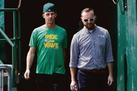  ?? Jeff Chiu / Associated Press ?? A’s pitcher Chris Bassitt (left) with communicat­ions director Mark Ling. Oakland has not set a timeline for Bassitt’s return.