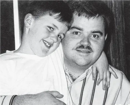  ?? HANDOUT PHOTO / AP ?? Irving police officer Aubrey Hawkins is seen with his son in this undated photo. Hawkins was killed in a 2000 Christmas Eve robbery of an Oshman’s store in Irving, and three of the “Texas 7” have been executed for the murder so far.