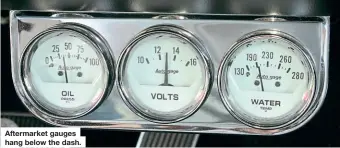  ??  ?? Aftermarke­t gauges hang below the dash.