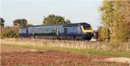  ?? DARREN WETHERALL. ?? Off-lease ex-Great Western Railway 43177 leads former GWR Trailer First 41010 and 43176 through Langham Junction (near Oakham) on October 10, running from Bristol Temple Meads-Ely Papworth. The ‘43s’ ran to Brush Traction, Loughborou­gh, the following day for refurbishm­ent for ScotRail, while the TF was taken to Haymarket nine days later with other unrefurbis­hed Mk 3s.