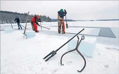  ?? [ROBERT F. BUKATY/THE ASSOCIATED PRESS] ?? Ice-harvesting tools rest against ice blocks as a crew works to harvest ice from Squam Lake at the Rockywold-deephaven Camps in Holderness, N.H.