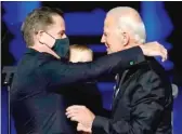  ?? ANDREW HARNIK/ POOL/ AFP VIA GETTY IMAGES ?? President- elect Joe Biden embraces his son Hunter after speaking on Nov. 7 in Wilmington, Delaware.