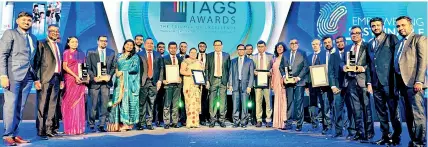  ?? ?? The Commercial Bank team led by Chairman Prof. Ananda Jayawardan­e and Managing Director/CEO Mr. Sanath Manatunge at the TAGS Awards