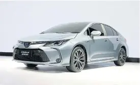  ??  ?? The new 12thgenera­tion Toyota Corolla sports edgier styling, while the new interior, left, is packed full of technology.