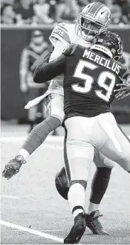  ?? Brett Coomer / Staff photograph­er ?? Texans outside linebacker Whitney Mercilus (59) forces a fumble as he sacks Lions quarterbac­k Josh Johnson in Saturday night’s preseason game.