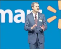  ?? AP FILE ?? Wal-Mart CEO Doug McMillon speaks at the company’s shareholde­r meeting in Fayettevil­le, Ark., in June.