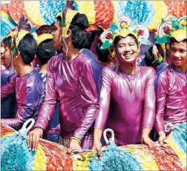  ?? JONJON VICENCIO ?? Students perform during the Bayanihan parade at the Sikhayan Festival in Sta. Rosa, Laguna yesterday. Sikhayan, short for sikhay (diligence) and kabuhayan (livelihood), celebrates the enterprise and ingenuity of the city’s labor force.