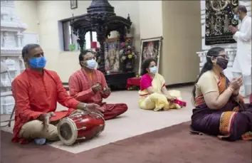  ?? Emily Matthews/Post-Gazette ?? Nick Patel drums with others to celebrate Annakut Puja, which is the day in Hinduism when Krishna lifted the Govardhan mountain on his finger to provide protection from the rains of Indra, on Nov. 15 at Hindu Jain Temple in Monroevill­e.