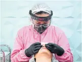  ?? RAUL ARBOLEDA AFP VIA GETTY IMAGES ?? Dr. Vinita Dubey said facial services are limited to Stage 3 because they are higher risk, entailing clients to remove masks.