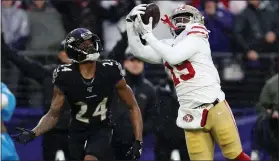  ?? PATRICK SMITH — GETTY IMAGES ?? 49ers wide receiver Deebo Samuel catches a 33-yard touchdown pass against the Baltimore Ravens during a 2019 game in Baltimore.