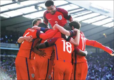  ?? RUSSELL CHEYNE / REUTERS ?? England's Harry Kane celebrates knotting the score in stoppage time of Saturday’s 2-2 World Cup qualifier against Scotland in Glasgow.