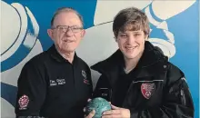  ?? SPECIAL TO THE ST. CATHARINES STANDARD ?? Special Olympics coach Tim Dixon, left, with bowler Ryan Kulikowski.