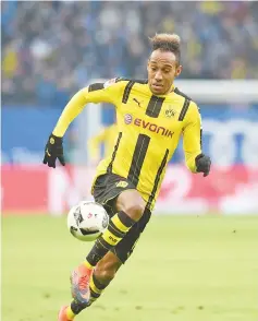  ?? Photo —AFP ?? This file photo taken on November 5, 2016 shows Pierre-Emerick Aubameyang from Dortmund running with the ball during the German first division Bundesliga football match between Hamburg SV and BVB Borussia Dortmund in Hamburg, northern Germany.