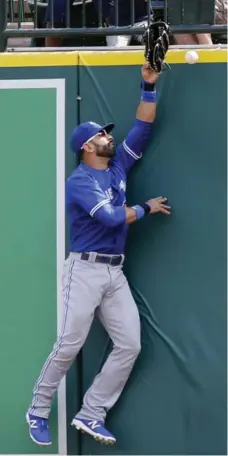  ?? DUANE BURLESON/GETTY IMAGES ?? Blue Jay Jose Bautista, who homered in the fifth, couldn’t pull back this blast off the bat of the Tigers’ J.D. Martinez in the eighth inning on Sunday.