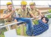  ?? PTI ?? Police try to detain a man protesting against the arrest of activists ▪ in Hyderabad on Wednesday.