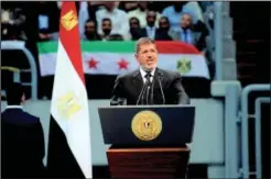  ?? AP photo ?? Egyptian President Mohammed Morsi addresses a rally called for by hardline Islamists loyal to the Egyptian president to show solidarity with the people of Syria, in a stadium in Cairo, Egypt, on Sunday.