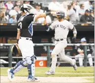  ?? Nuccio DiNuzzo / Getty Images ?? Gleyber Torres of the Yankees scores during the eighth inning of Sunday’s game against the White Sox at Guaranteed Rate Field in Chicago.