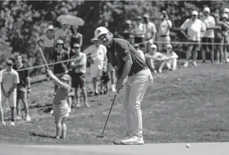  ?? Seth Wenig/Associated Press ?? Xander Schauffele putts on the fourth hole Saturday during the third round of the Travelers Championsh­ip at TPC River Highlands in Cromwell, Conn. Schauffele, the 54-hole leader, can claim his sixth PGA Tour title — and first since 2019 — with a victory Sunday.