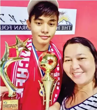  ??  ?? BEST goalkeeper Andre Ebuna with his mom Pinky. He was selected to the 2019 Allianz Explorer Camp in Munich, Germany. (Supplied Photo)