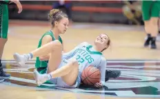  ??  ?? RIGHT: Pojoaque Valley’s Dallas Archibald, left, and Moriarty’s Alyssa Adams collide at midcourt during a 4A semifinal game Thursday. Adams scored 29 points in Moriarty’s 47-38 win.