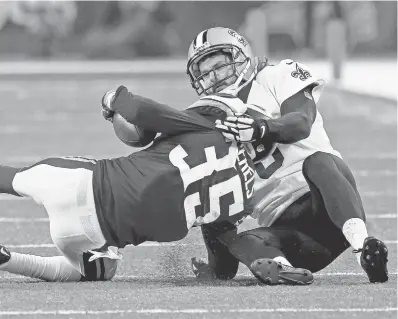  ?? MATTHEW HINTON/AP ?? The Saints’ Thomas Morstead suffered a rib injury Sunday on this TD-saving tackle of Vikings return man Marcus Sherels.