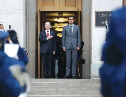  ?? (Reuters) ?? US SECRETARY of Defense James Mattis stands with Qatari Emir Sheikh Tamim Bin Hamad Al-Thani during an Enhanced Honor Cordon at the Pentagon in Washington.