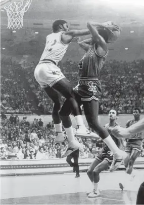  ?? THE COMMERCIAL APPEAL FILES ?? March 6, 1982: Memphis State’s Phillip Haynes blocks a shot by Louisville’s Lancaster Gordon.