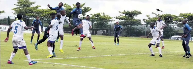  ??  ?? Sandile Mthethwa leaps high to meet a corner kick as Richards Bay mount yet another aerial attack in the second half