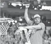  ?? KEVIN JAIRAJ/USA TODAY SPORTS ?? North Carolina State forward DJ Burns Jr. went after Duke with mid-range jumpers and hesitation moves, up-and-under layups and finishes in transition in the South Regional title game.