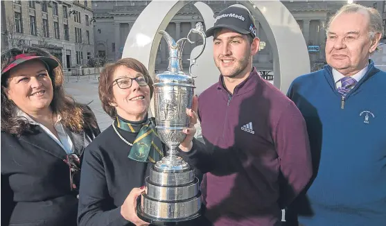  ??  ?? Dundee City councillor Lynne Short , Carnoustie Golf Links chairwoman Pat Sawers, Bradley Neil and Angus councillor Ron Sturrock with the iconic Claret Jug in Dundee City Square. Picture: Alan Richardson.