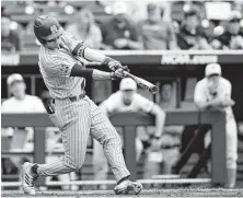  ?? Nati Harnik / Associated Press ?? Mississipp­i State’s Jordan Westburg connects on second-inning grand slam that helped the Bulldogs rout North Carolina.