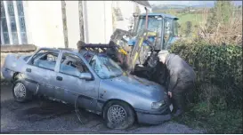  ?? (Pic: John Ahern) ?? THEY WON’T PARK THERE AGAIN! Community activist, Willie Rice, assisting with the recovery of a vehicle for the scrap metal collection in Araglin.