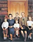  ??  ?? The Queen, with the Duke of Edinburgh and their grandchild­ren in 1987, reportedly loves the film Flash Gordon, inset