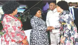  ?? ?? First Lady Dr Auxillia Mnangagwa shares a lighter moment with Vice President Dr Constantin­o Chiwenga and his wife Colonel Miniyothab­o Baloyi-Chiwenga who were dressed in the yesteryear fashion during the fundraisin­g dinner at State House on Friday