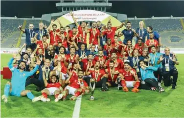  ?? Courtesy: Al Ahly Twitter ?? ↑
Al Ahly players celebrate with the trophy after winning the CAF Champions League final against Kaizer Chiefs in Casablanca on Saturday.
