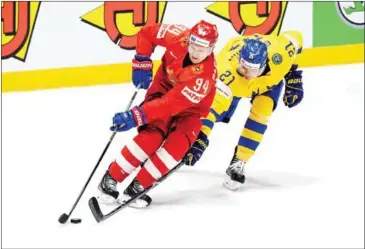  ?? AFP ?? Russian Alexander Barabanov vies for the puck during the IIHF Men’s Ice Hockey World Championsh­ips.