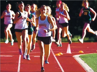  ?? SHMUELTHAL­ER-SANTACRUZS­ENTINEL ?? Soquel’s Emma McCain leads the pack around the fourth turn in the 3,200-meter cross country race against Harbor at Santa Cruz High’s track Thursday. McCain, who will run for Cal Poly San Luis Obispo next year, led from the start and never looked back.
