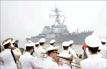  ?? JOHANNES EISELE/AFP ?? The USS (pictured) on Sunday passed less than 12 nautical miles from Triton Island in the Paracel Islands archipelag­o in the South China Sea occupied by Beijing.
