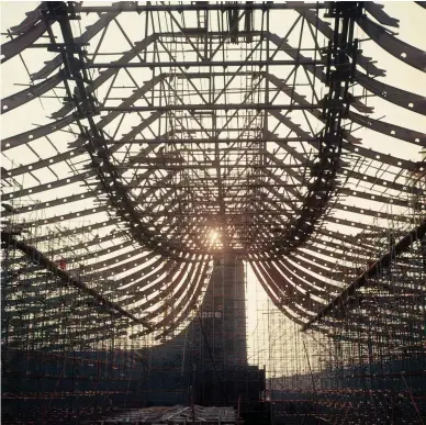  ??  ?? Raising the roof The extraordin­ary suspended roof of Yoyogi National Gymnasium during constructi­on in 1964. Some Japanese criticised the cost of hosting the Games