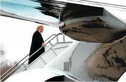  ?? JACQUELYN MARTIN/ASSOCIATED PRESS ?? President Donald Trump boards Air Force One after addressing the American Farm Bureau Federation convention in New Orleans, where he defended holding out for wall funding.