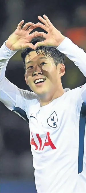  ??  ?? FAVOURITE SON: Heung-Min Son celebrates scoring Spurs’ winner last night