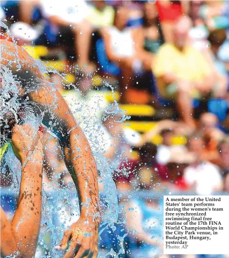  ??  ?? A member of the United States' team performs during the women's team free synchroniz­ed swimming final free routine of the 17th FINA World Championsh­ips in the City Park venue, in Budapest, Hungary, yesterday Photo: AP