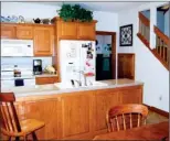  ??  ?? Ideal for family dinners or entertaini­ng, the kitchen is open to the main dining area.