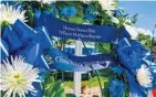  ?? AILEEN PERILLA/STAFF FILE PHOTO ?? A wreath at the Kissimmee Police Department honors Officer Matthew Baxter, who was killed along with Sgt. Richard Howard in August.
