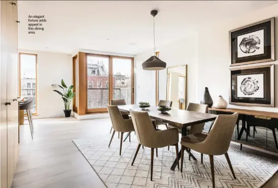  ?? Design Recipes/TNS ?? An elegant fixture adds appeal in this dining area.