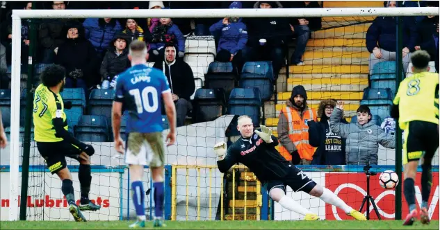  ?? PICTURES: Action Images ?? BROWN AND OUT: Isiah Brown, on loan to Huddersfie­ld from Chelsea, scores from the penalty spot Brown as Rochdale suffer another humbling