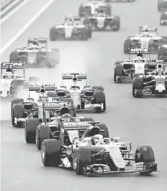  ??  ?? Mercedes’ Formula One driver Lewis Hamilton of Britain leads the pack during Sunday’s race in Abu Dhabi. — Reuters photo