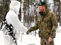  ??  ?? Steadfast support...Harry and serviceman in Norway