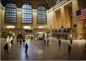  ?? JOHN MINCHILLO — ASSOCIATED PRESS ?? The main concourse at Grand Central Terminal in Manhattan was sparsely populated just before 5 p.m. on Friday, March 20, 2020.